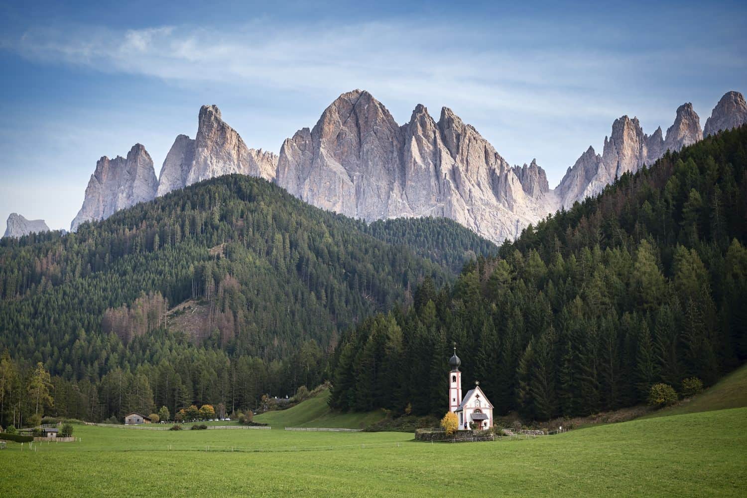 chiesetta di san giovanni in val di funes dolomites italy with Seceda mountains in the background