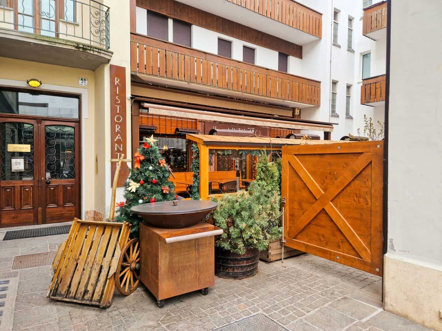 restaurant il vizietto in cortina d ampezzo in the dolomites with wooden decor and christmas decorations
