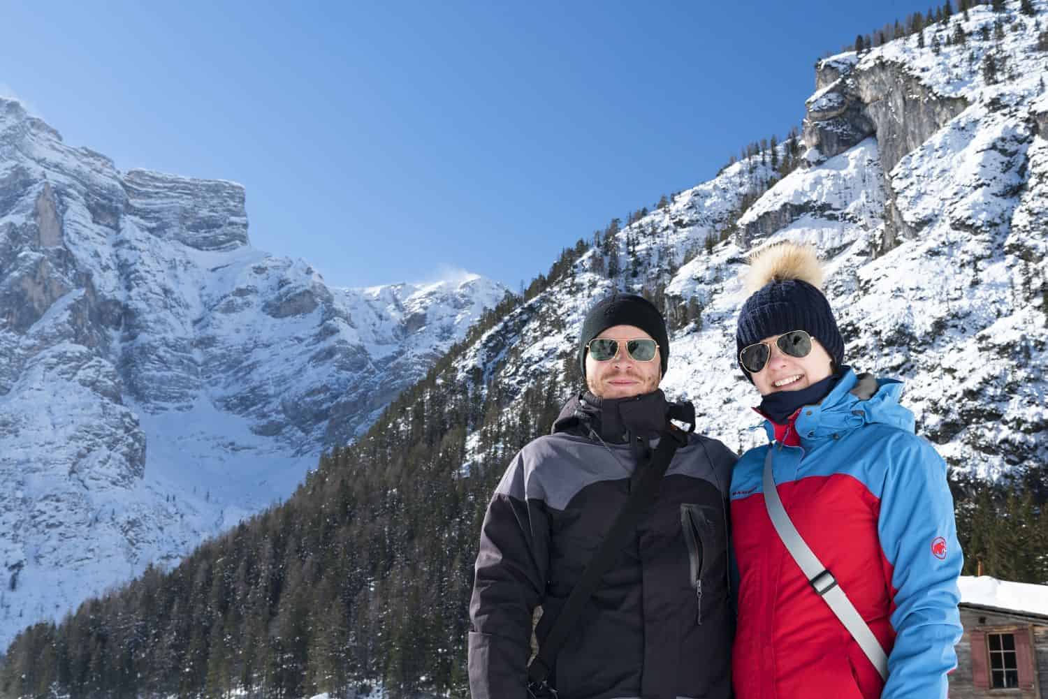 kristine and michal in lago di braies dolomites italy with snowy mountains in the background