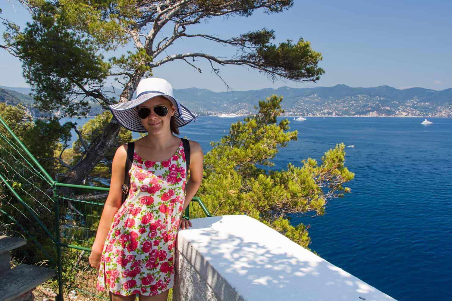 kristine on a passage in cinque terre italy with the mediterranean sea and mountains in the background