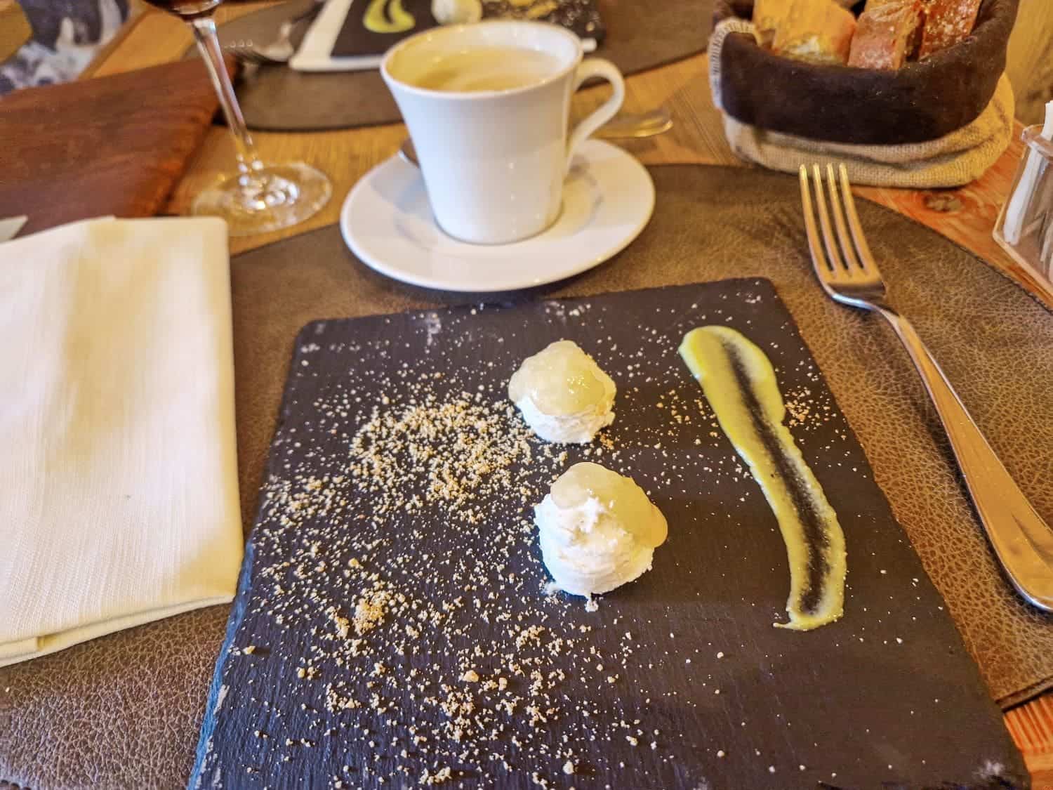 a little snack arranged like a smiley face in restaurant il vizietto in cortina d'ampezzo in dolomites