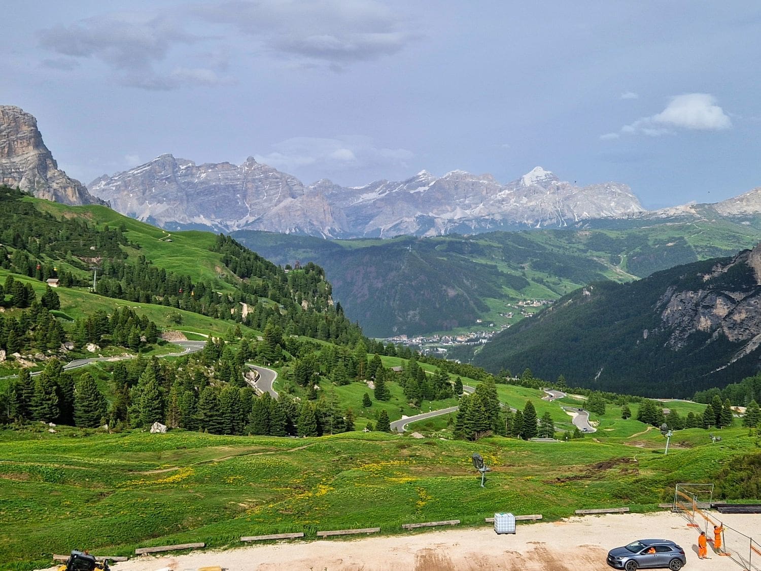 view of alta badia from passo gardena in the dolomites in june with high mountains in the background